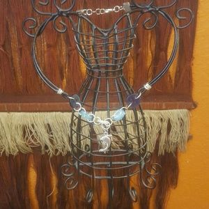 * Vintage button necklace with dolphin charm.